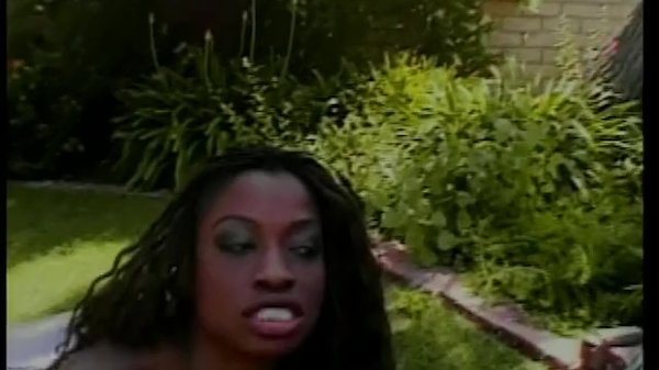 Black slut fucks on lawn